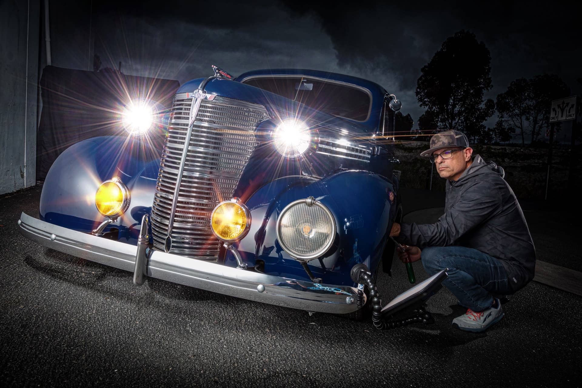 Deep paint reflections on a classic car at night in San Diego