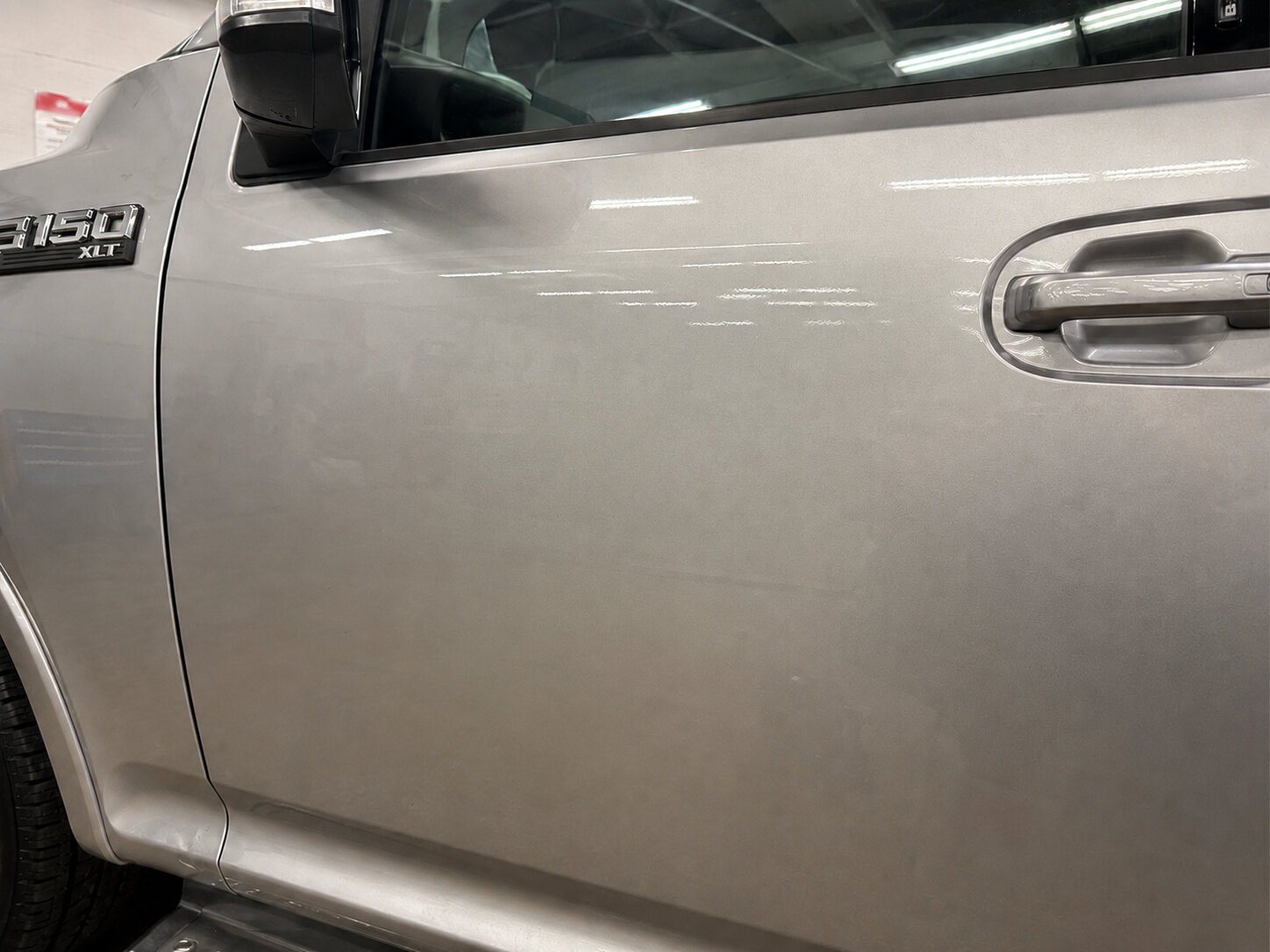 Ford F-150 aluminum door after paintless dent repair