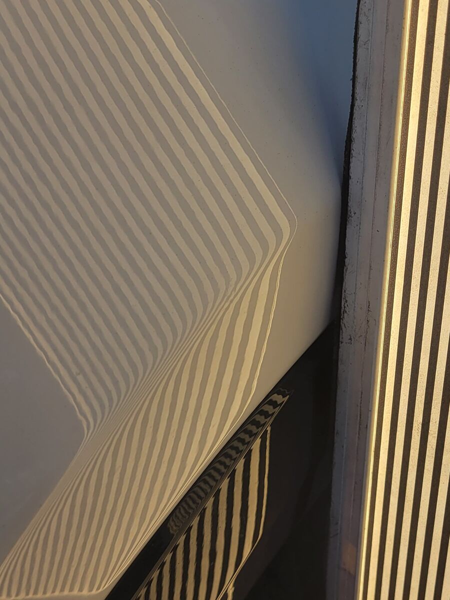 Reflection board lines running straight across the panel after the dent was worked out