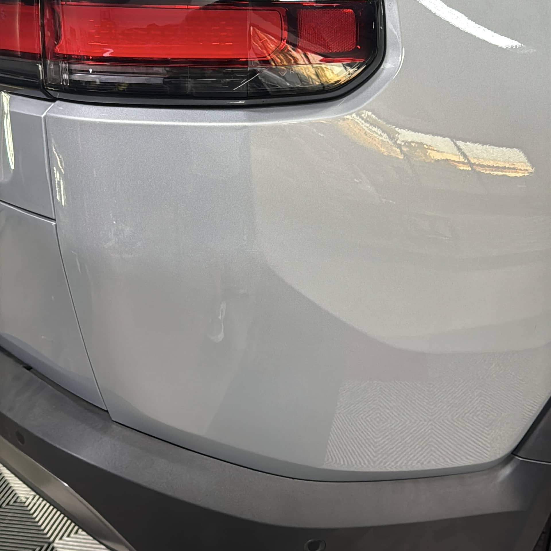 Rivian R1S rear quarter after paintless dent repair