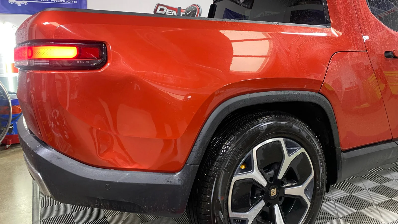 Large rear quarter-panel dent after paintless dent repair, back to factory shape