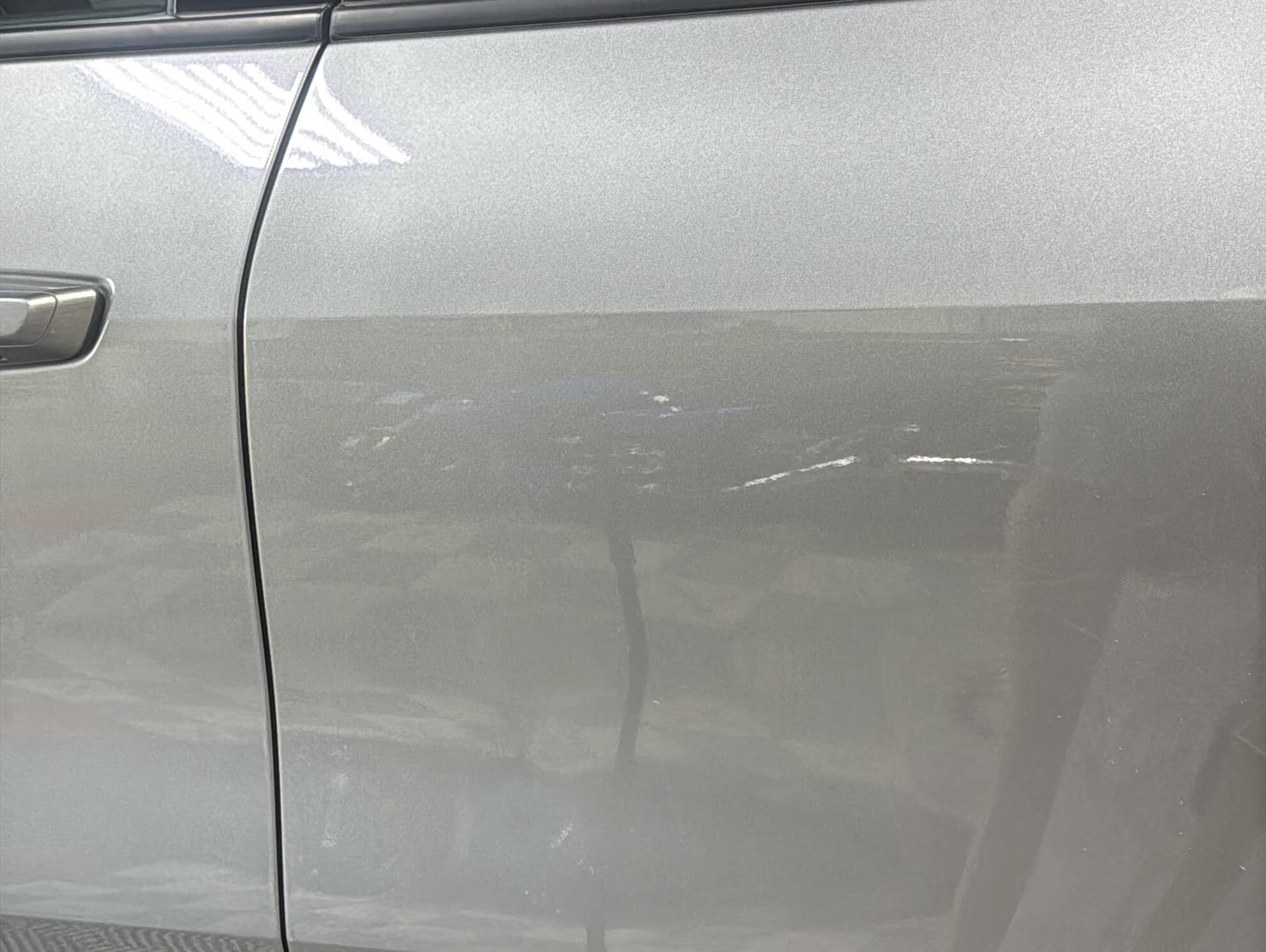 Chevy Traverse driver door after paintless dent repair