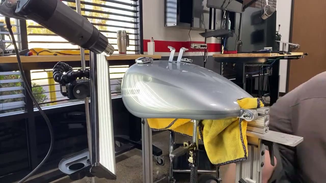 Harley tank dent removal demonstration showing the tool reaching the back of the panel